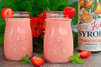 Healthy strawberry-carrot smoothie with orange