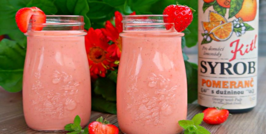 Healthy strawberry-carrot smoothie with orange
